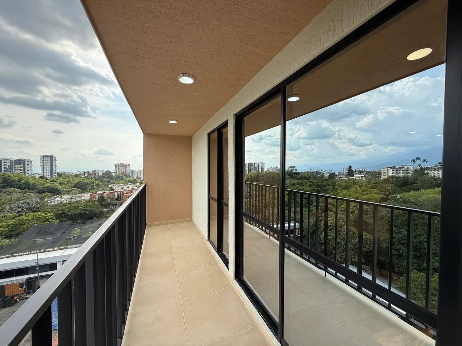 Real photograph of apartment 806's balcony at Hito 18, with a view of the mountains